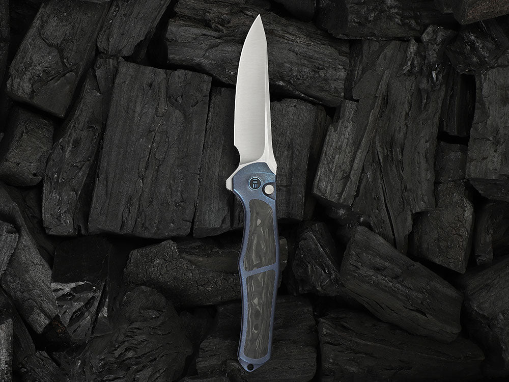 # ** HERE NOW ** - WE Knives - WE07B 702XI 11TH ANNIVERSARY KNIFE- 3.81 INCH M390 Blade - INTEGRAL Handle