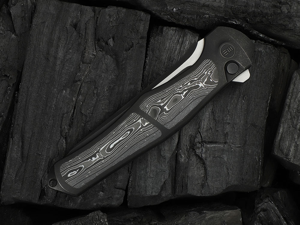 # ** HERE NOW ** - WE Knives - WE07B 702XI 11TH ANNIVERSARY KNIFE- 3.81 INCH M390 Blade - INTEGRAL Handle