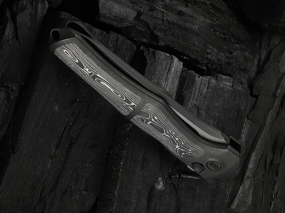 # ** HERE NOW ** - WE Knives - WE07B 702XI 11TH ANNIVERSARY KNIFE- 3.81 INCH M390 Blade - INTEGRAL Handle