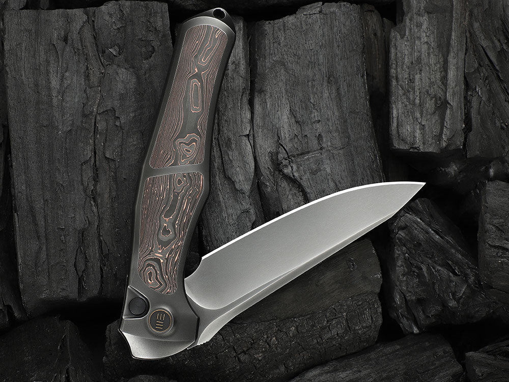 # ** HERE NOW ** - WE Knives - WE07B 702XI 11TH ANNIVERSARY KNIFE- 3.81 INCH M390 Blade - INTEGRAL Handle