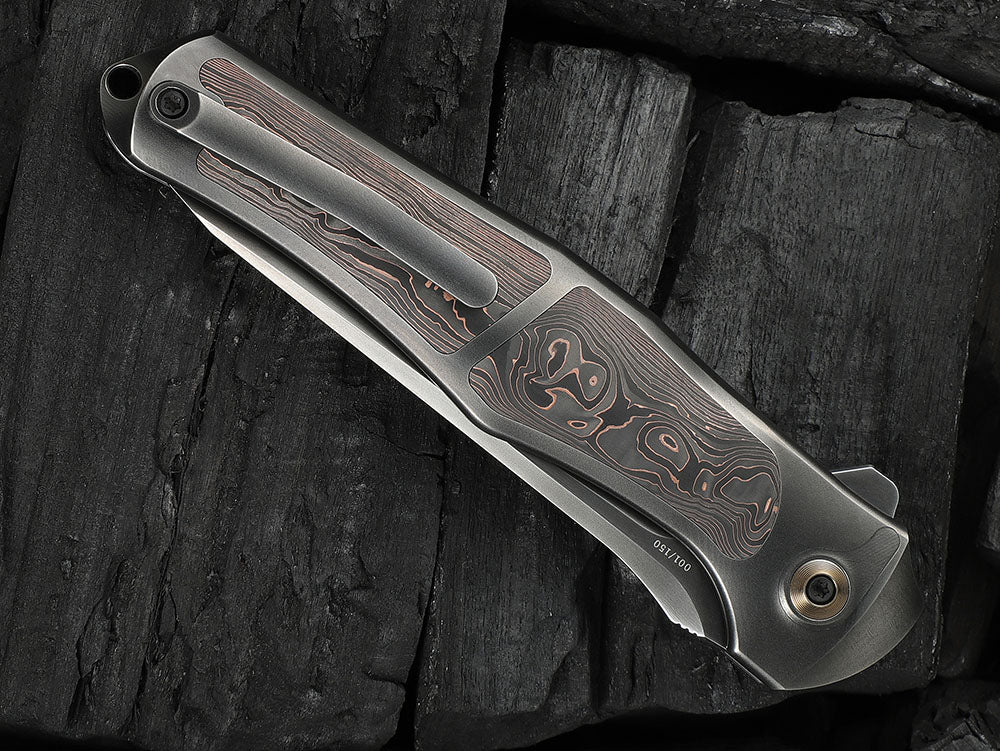 # ** HERE NOW ** - WE Knives - WE07B 702XI 11TH ANNIVERSARY KNIFE- 3.81 INCH M390 Blade - INTEGRAL Handle