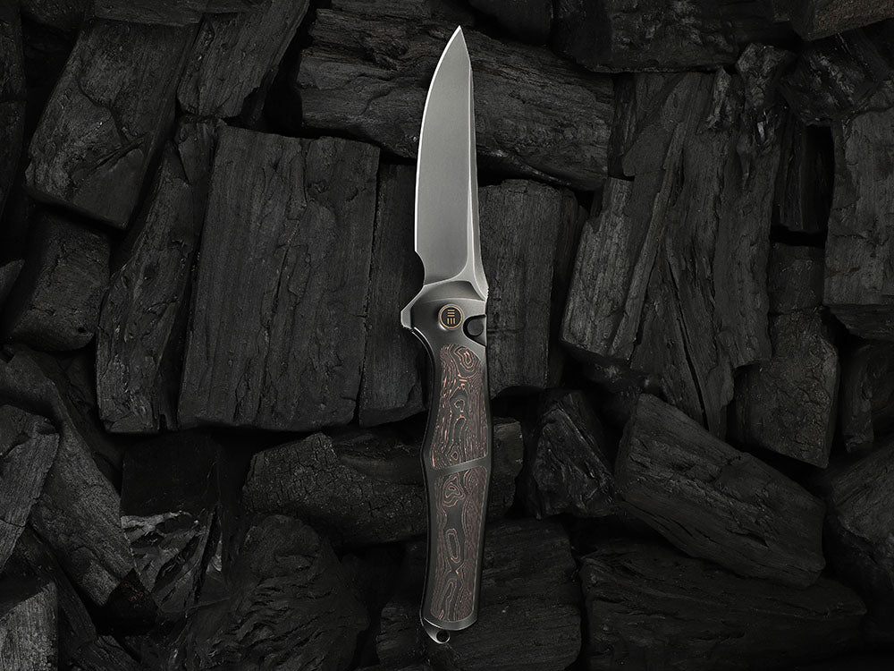 # ** HERE NOW ** - WE Knives - WE07B 702XI 11TH ANNIVERSARY KNIFE- 3.81 INCH M390 Blade - INTEGRAL Handle