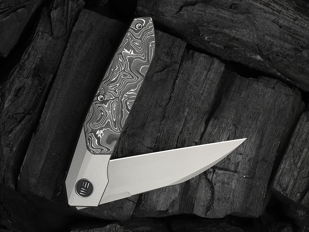 # ** HERE NOW ** - WE Knives - WE24007 Brr15 - 3.25 INCH M390 Blade - Titanium Handle - Rafal Brzeski