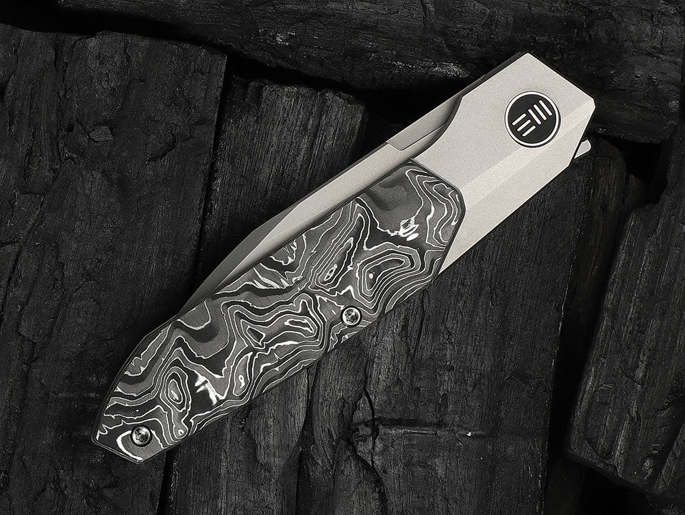 # ** HERE NOW ** - WE Knives - WE24007 Brr15 - 3.25 INCH M390 Blade - Titanium Handle - Rafal Brzeski