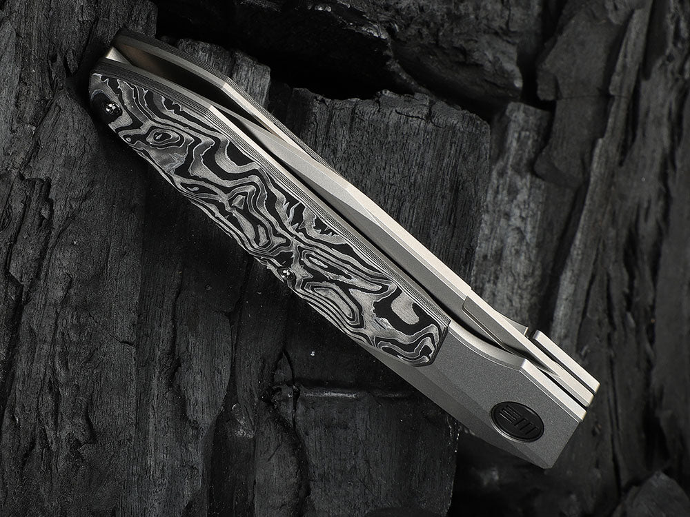 # ** HERE NOW ** - WE Knives - WE24007 Brr15 - 3.25 INCH M390 Blade - Titanium Handle - Rafal Brzeski