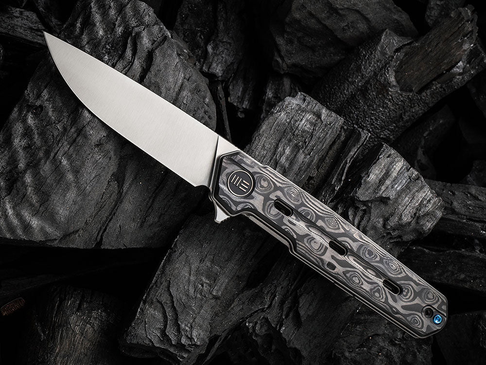 # ** HERE NOW ** WE Knife - WE22026 NAVO - 20CV Blade - Titanium Handle - OSTAP HEL DESIGN - True Talon