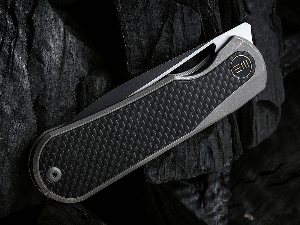 # ** HERE NOW ** WE Knife WE-WE21033 - BALOO - 20CV or Damasteel Blade - CARBON FIBER HANDLE - OSTAP HEL DESIGN